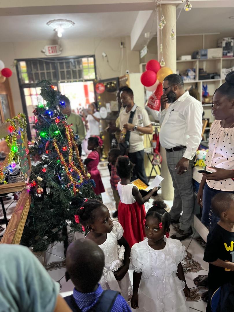 Young girls in white dresses at the SCH Christmas celebration