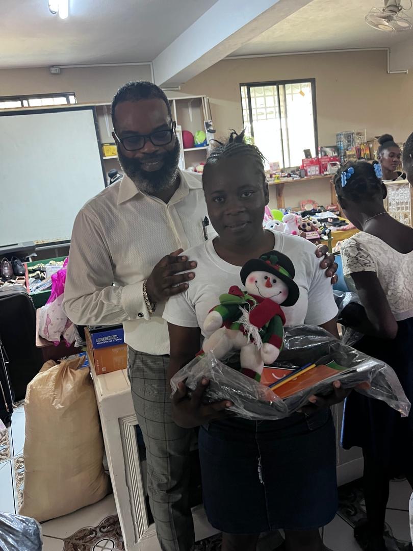 Woman with backpack and snowman toy at the SCH event