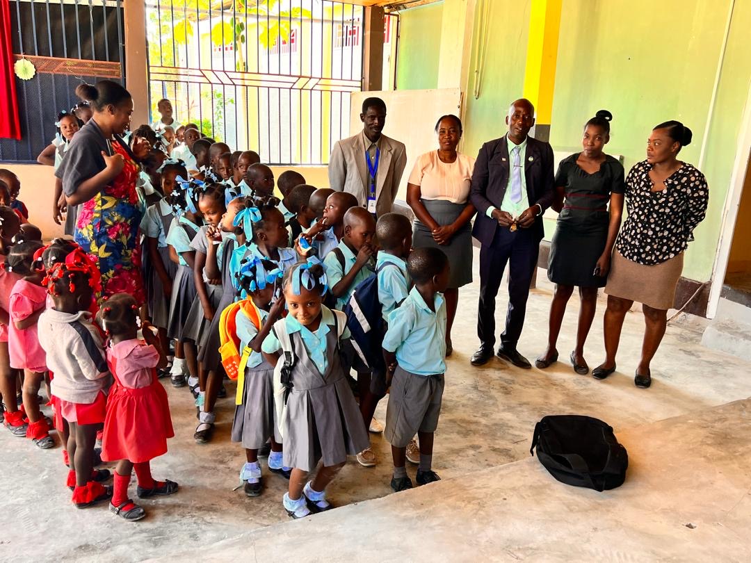 Teachers and staff with students at the SCH school